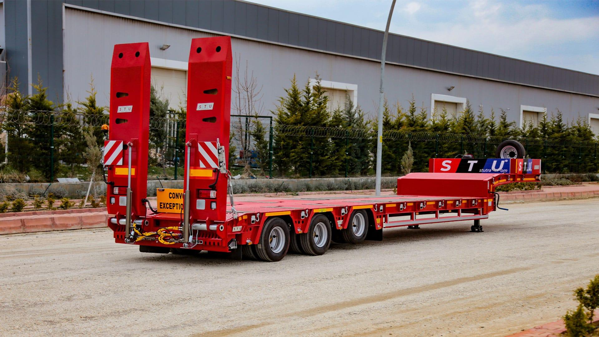 Heavy Equipment by Low bed Trailers